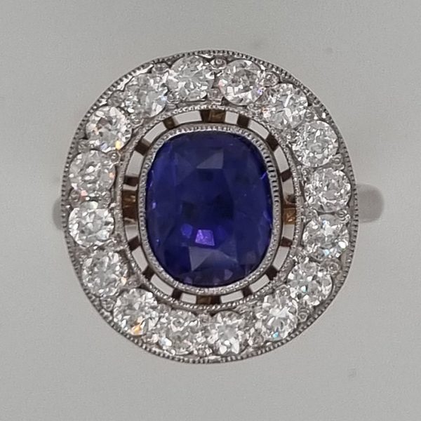 Vintage Certified Natural Colour Change Sapphire and Diamond Cluster Ring. Colour change sapphire is blue in natural light and purple in indoor lighting