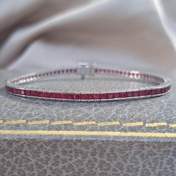 Channel Set Square Cut Ruby Line Tennis Bracelet in 18ct White Gold, 6.56 carats