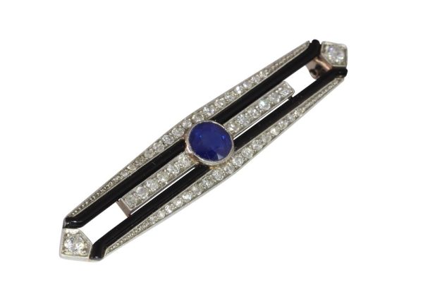 Art Deco diamond, sapphire and onyx bar brooch in white gold.