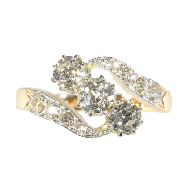 Antique diamond engagement ring in gold and platinum.