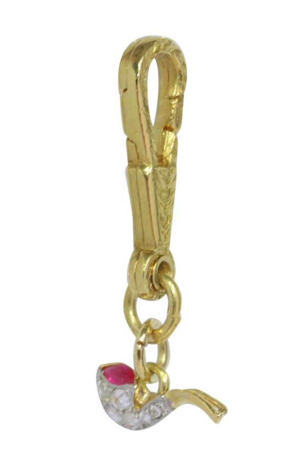 Art Deco diamond and ruby pendant in gold and platinum.