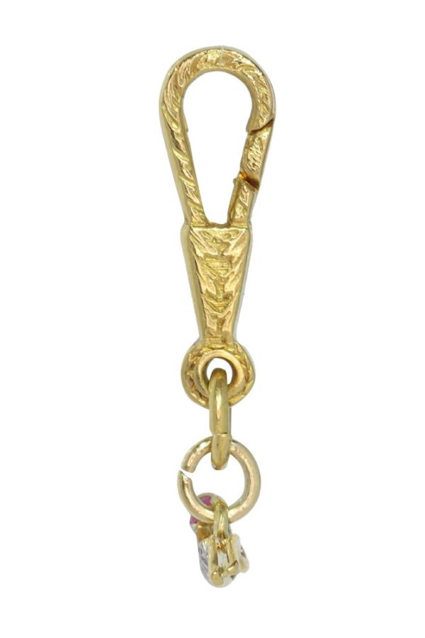 Art Deco diamond and ruby pendant in gold and platinum.