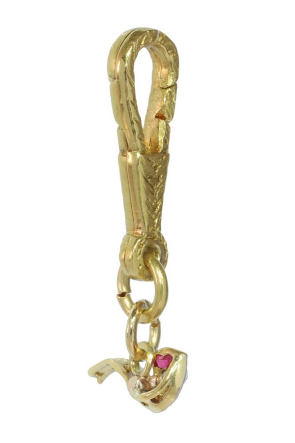 Art Deco diamond and ruby pendant in gold and platinum.