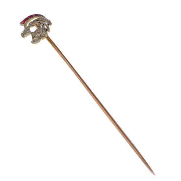 Art Deco stickpin with diamonds and rubies in gold.