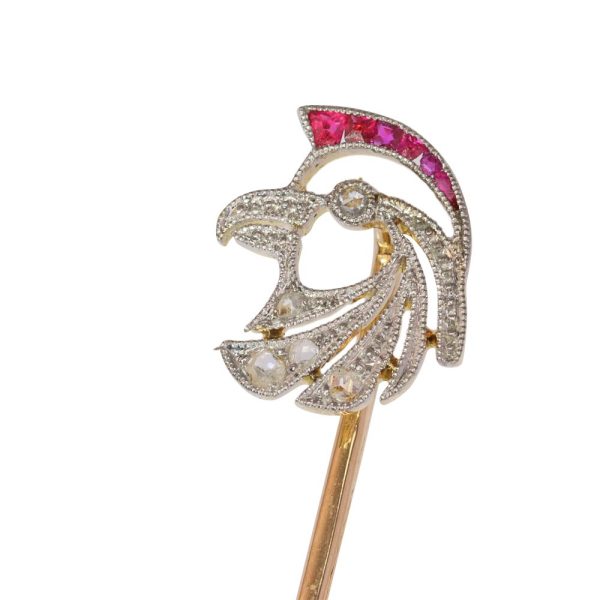 Art Deco stickpin with diamonds and rubies in gold.
