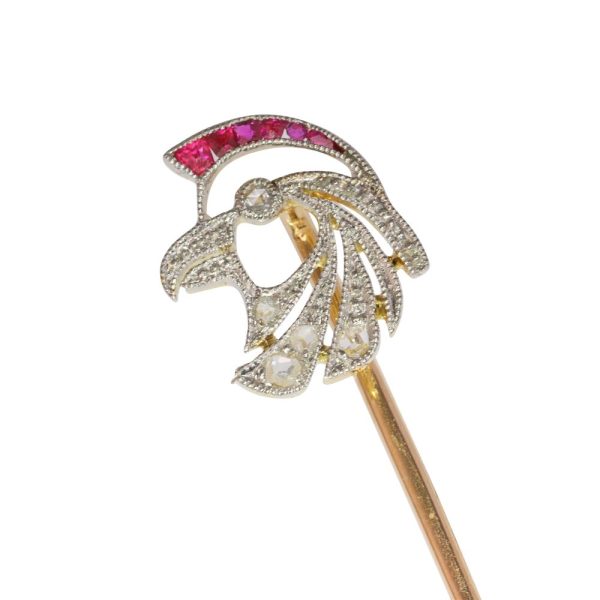 Art Deco stickpin with diamonds and rubies in gold.