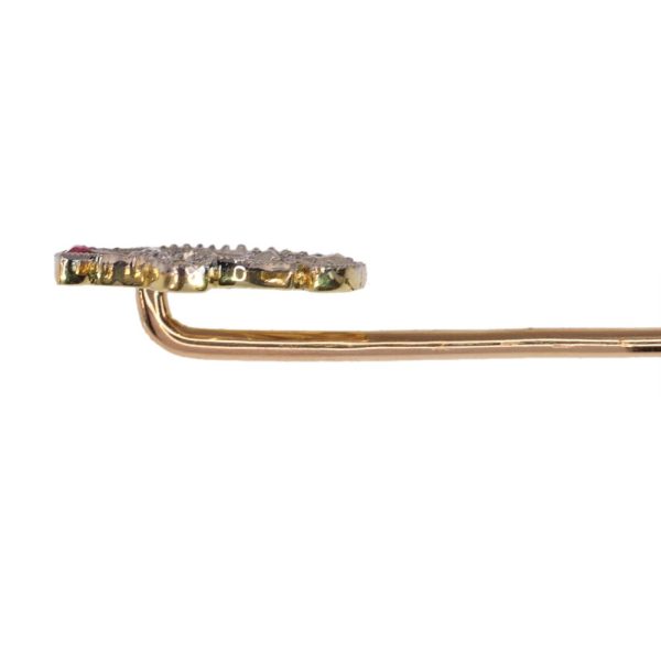 Art Deco stickpin with diamonds and rubies in gold.