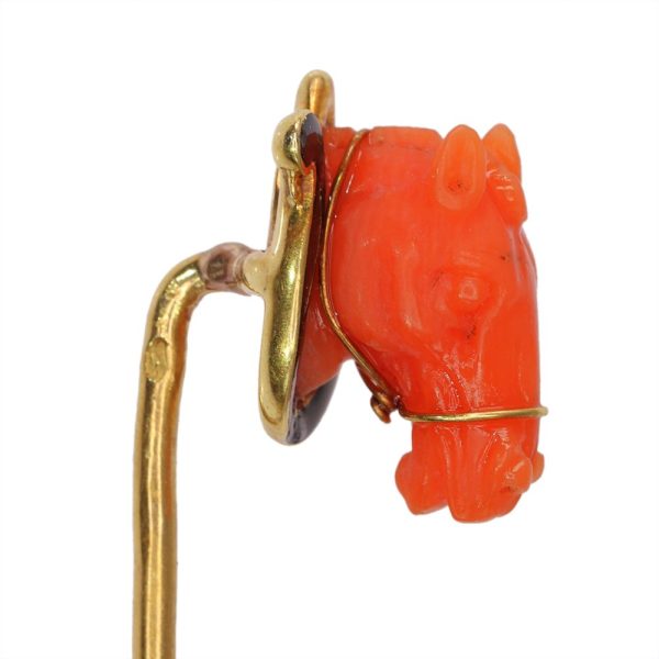 Antique horse head tie pin in gold with coral and enamel.