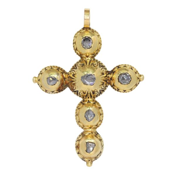Baroque diamond cross pendant in gold.