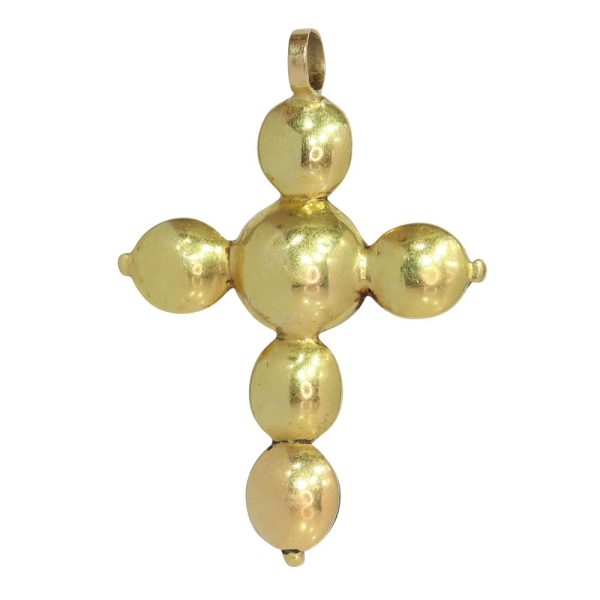 Baroque diamond cross pendant in gold.