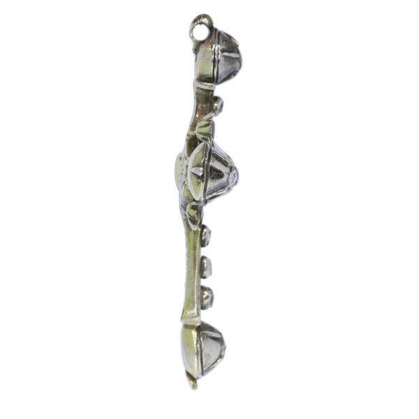 Rococo silver cross diamond set pendant.