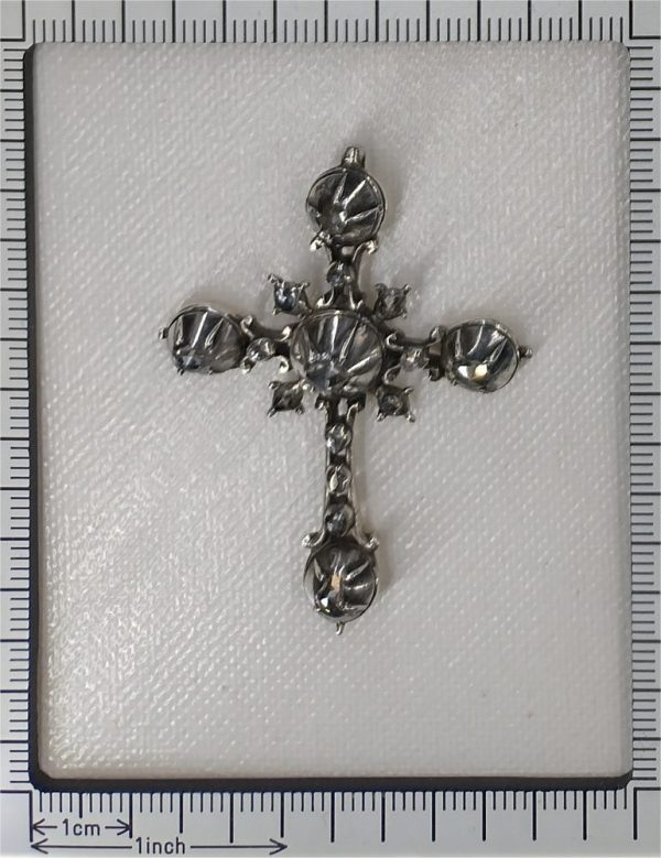 Rococo silver cross diamond set pendant.