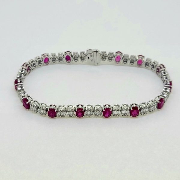 Ruby and Diamond Line Bracelet, 7.29 carats of oval-cut rubies alternated with 3.42cts diamonds in 18ct white gold