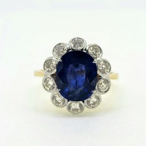 4.62ct Oval Sapphire and Diamond Cluster Engagement Ring