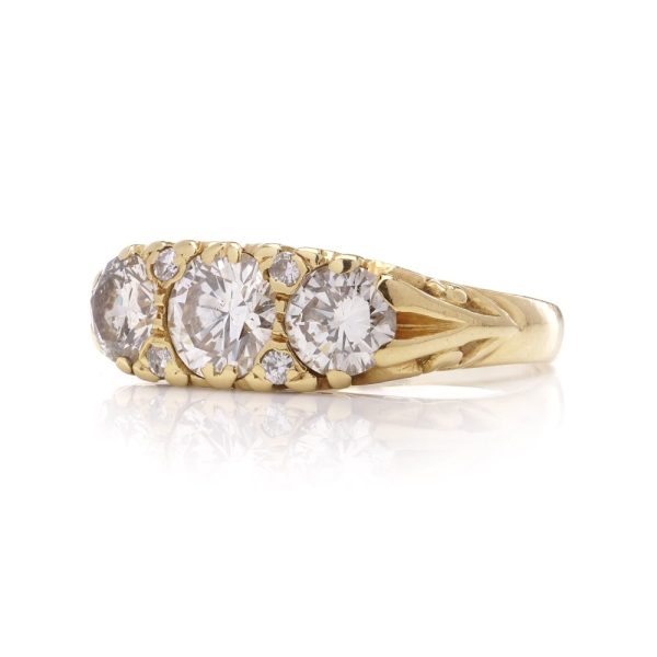 Three stone diamond ring in yellow gold
