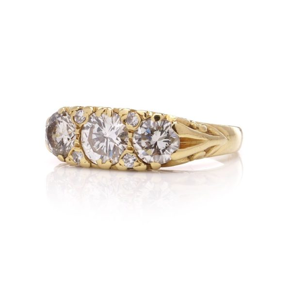 Three stone diamond ring in yellow gold