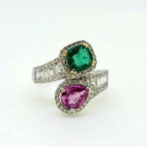 Contemporary 1.04ct Pear Cut Pink Sapphire 0.85ct Emerald and 0.77ct Diamond Cluster Toi et Moi Two Stone Crossover Ring in 18ct White Gold