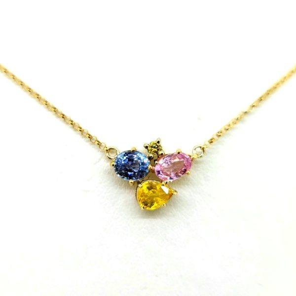 Multi Tri Colour Sapphire Pendant with Chain, pear cut and oval cut 0.74ct pink sapphire, 0.65ct yellow sapphire and blue sapphire with brilliant-cut diamond accents in 18ct yellow gold on fixed yellow gold trace chain