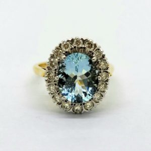 3.50ct Aquamarine and Diamond Oval Cluster Engagement Ring