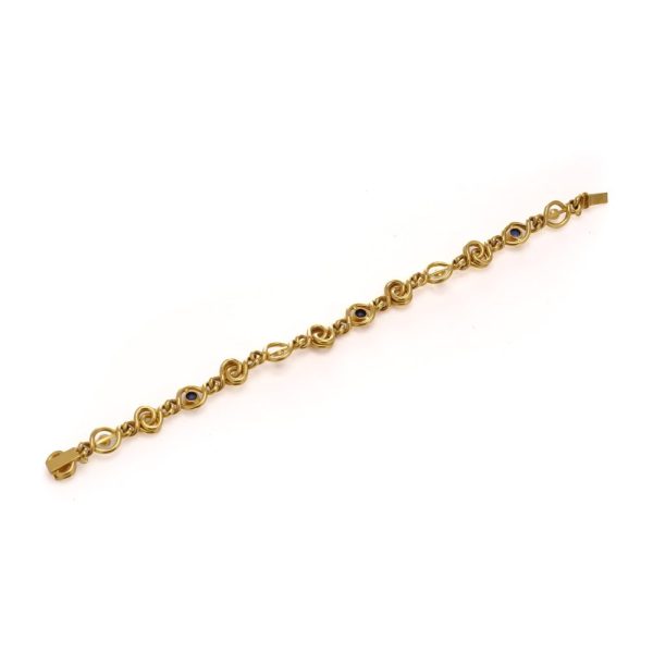 Antique sapphire and pearl bracelet in 24 carat gold.