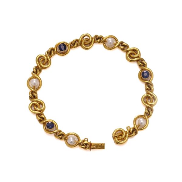 Antique sapphire and pearl bracelet in 24 carat gold.