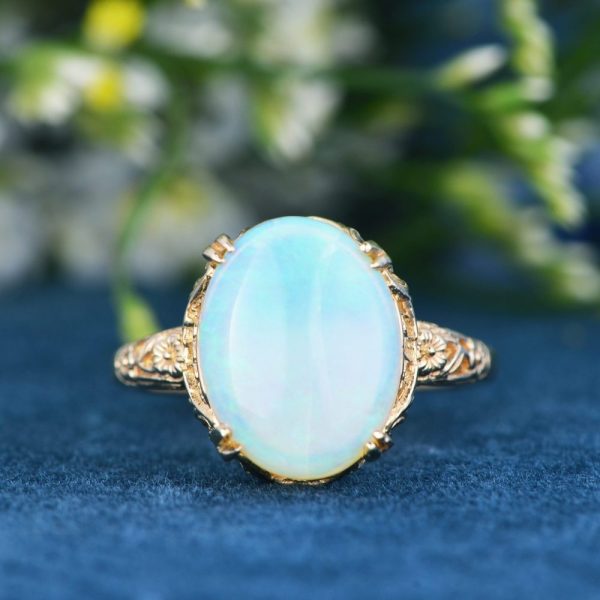Opal Solitaire Statement Ring in Filigree Yellow Gold, 2.84ct single stone oval cabochon opal claw set in 14ct yellow gold with beautiful filigree work accented with diamonds