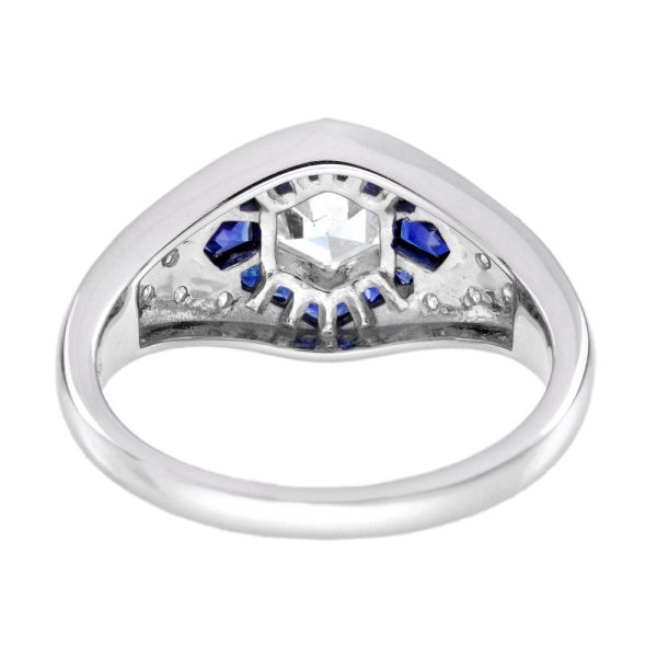 Unique Hexagonal Diamond and Sapphire Cluster Dress Ring, 0.45ct hexagonal-cut diamond surrounded by calibre French-cut sapphires on diamond-studded 18ct white gold mount