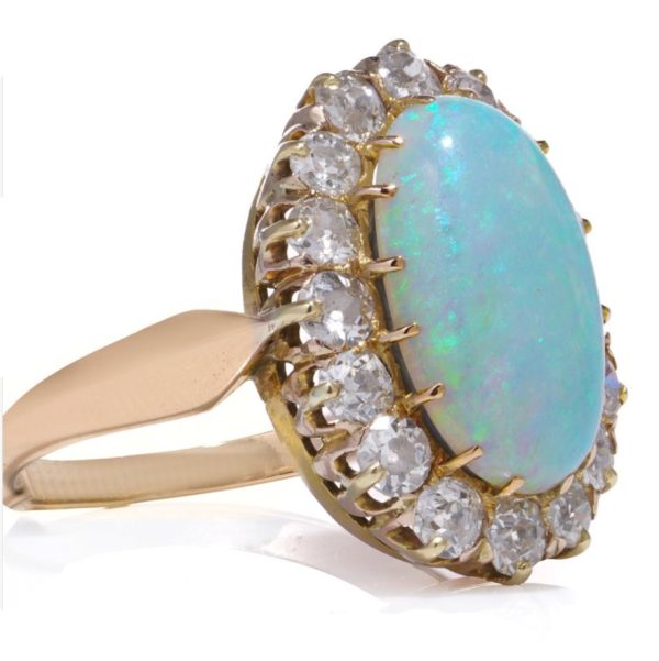 Victorian Antique Opal and Diamond Cluster Engagement Ring, oval cabochon opal surrounded by 1.12cts old-cut diamonds in 14ct yellow gold