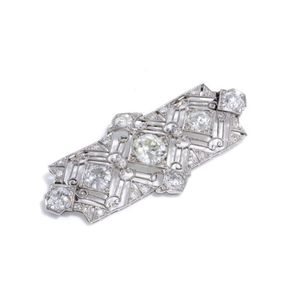 Art Deco 7.70ct Old Cut Diamond and Platinum Plaque Brooch, central 2.50ct old mine-cut diamond flanked with two 1.35ct old mine diamonds and two 1.25ct old mine diamonds framed by fine millegrain pierced decoration with diamond detailing