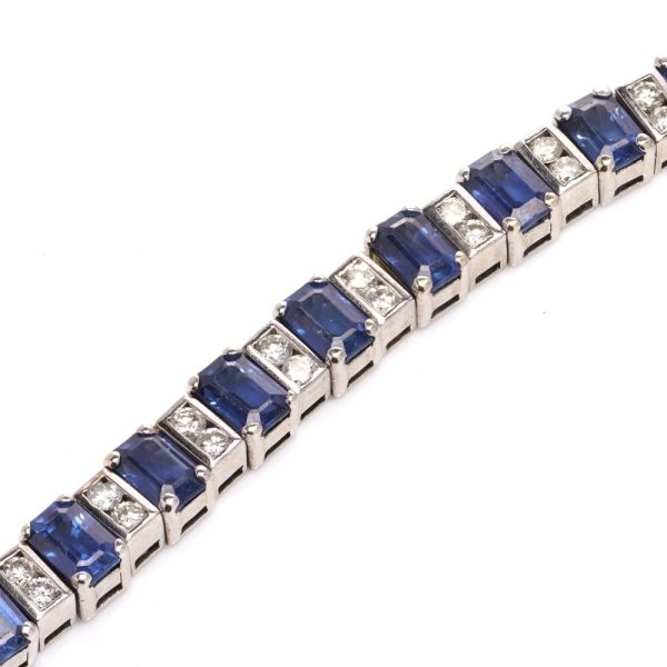 Sapphire and diamond link bracelet in white gold.