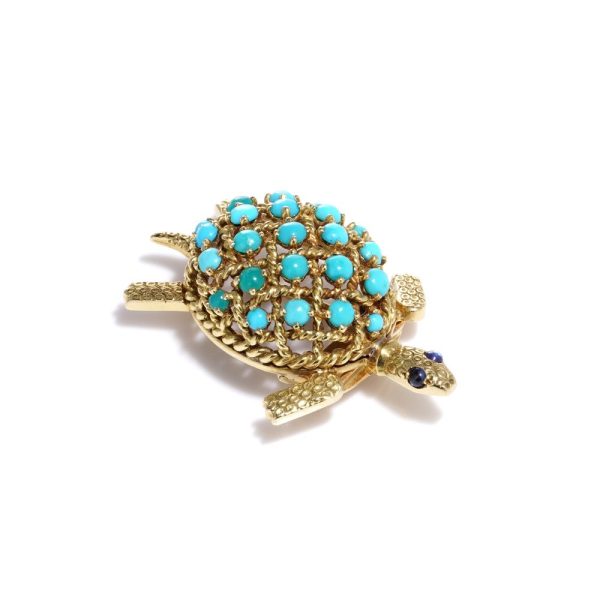 Turquoise tortoise brooch in yellow gold.