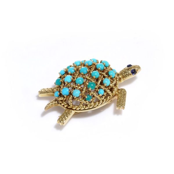 Turquoise tortoise brooch in yellow gold.