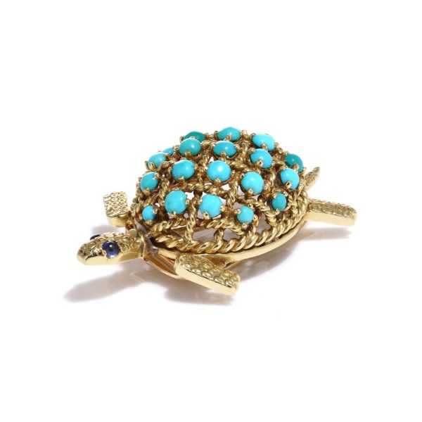 Turquoise tortoise brooch in yellow gold.