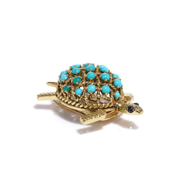 Turquoise tortoise brooch in yellow gold.