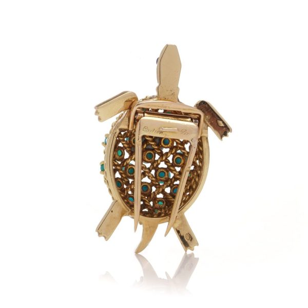 Turquoise tortoise brooch in yellow gold.