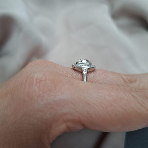 Antique 1.50ct Cushion Old Cut Diamond Halo Cluster Engagement Ring in platinum. Circa 1900s