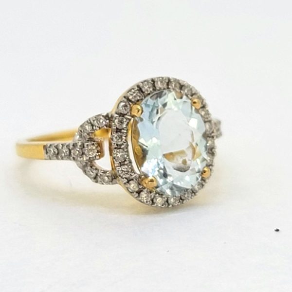 2.30ct Oval Aquamarine and Diamond Cluster Engagement Ring in 18cy Yellow Gold