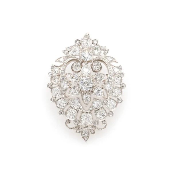 Diamond shield brooch in gold and silver.