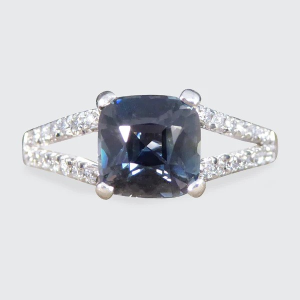 Teal sapphire and diamond ring in platinum.