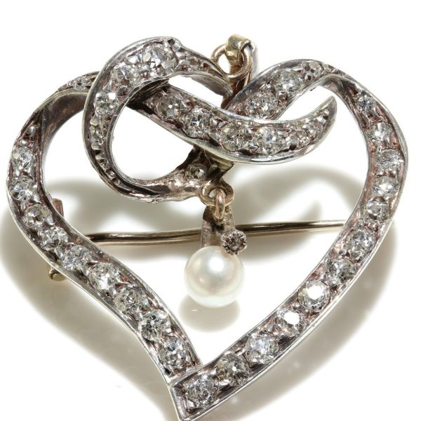 Heart brooch/pendant with old cut diamonds in gold and silver.