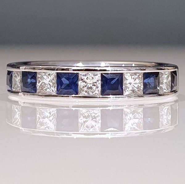 Princess Cut Diamond Sapphire and Diamond Half Eternity Ring, 11 alternating princess-cut diamonds and sapphires in 18ct white gold band