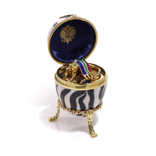 Faberge limited edition gold and enamel egg with gemstones.