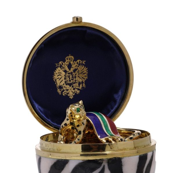 Faberge limited edition gold and enamel egg with gemstones.