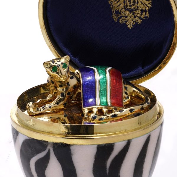 Faberge limited edition gold and enamel egg with gemstones.