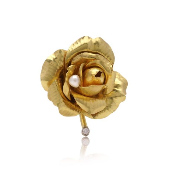 Cartier diamond and pearl rose brooch in gold.