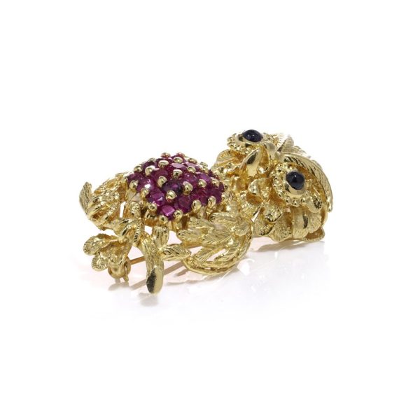 Vintage owl brooch with rubies and sapphires in gold.