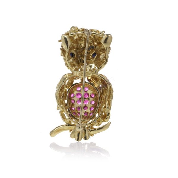 Vintage owl brooch with rubies and sapphires in gold.