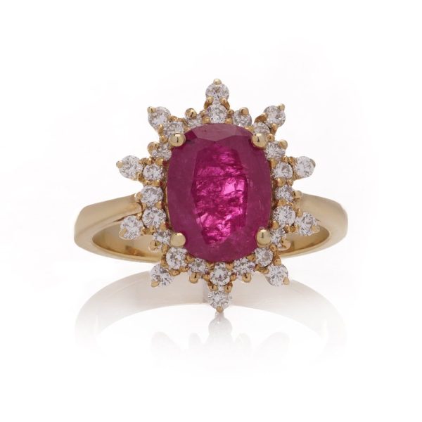 Ruby and diamond cluster ring in yellow gold.