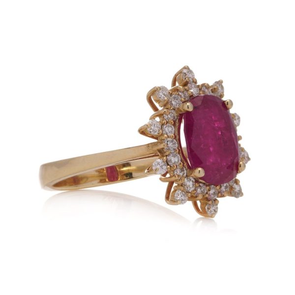 Ruby and diamond cluster ring in yellow gold.