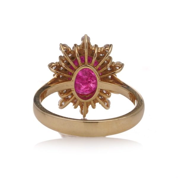 Ruby and diamond cluster ring in yellow gold.